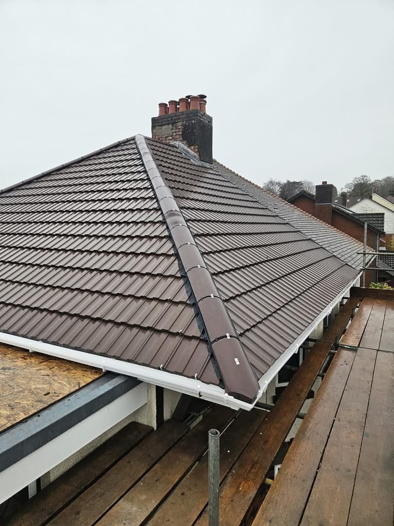 Tiled roof replacement with new gutters